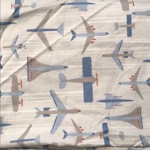 Blue airplane dwell studio crib skirt